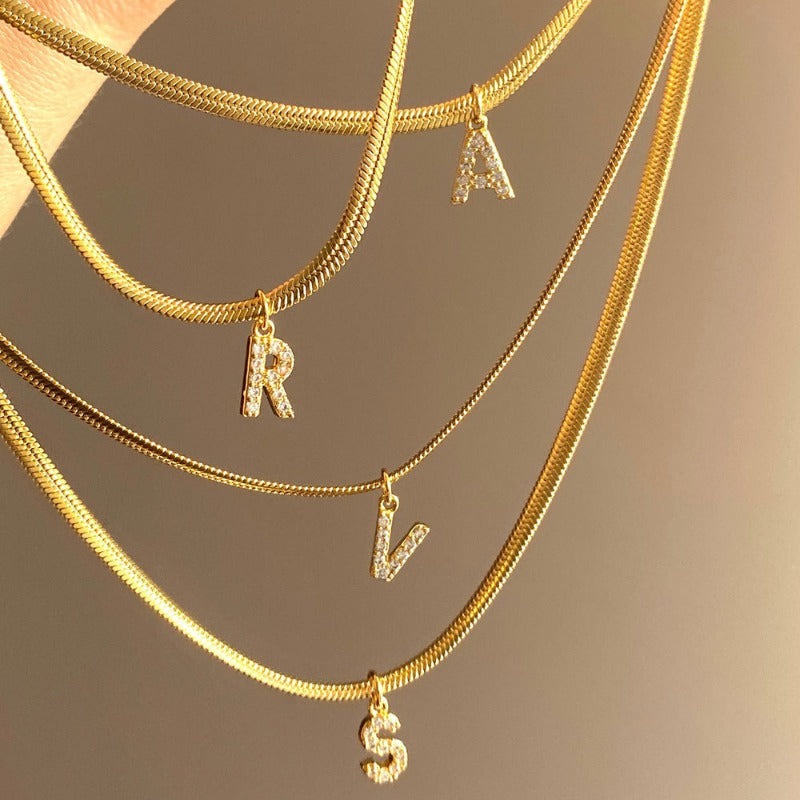 Wholesale French Retro Palace Style Flat Snake Bone Stacking Diamond 26 Letter Titanium Steel Clavicle Chain Necklace